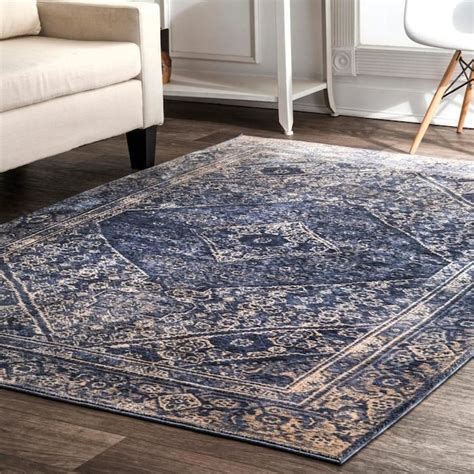 Features a trendsetting geometric inspired design with thick border in a rich color palette. . Lowes area rugs 9x12